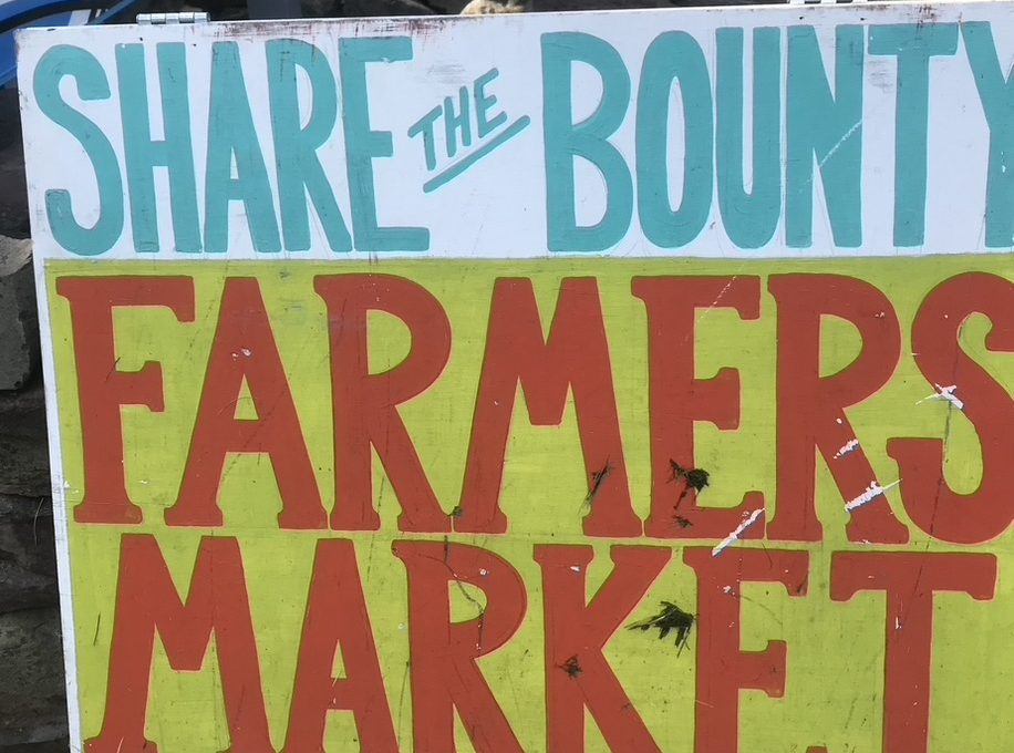 Painted sign at farmers market